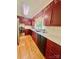 Kitchen featuring red cabinets, stainless appliances, and a double sink at 460 27Th Avenue Nw Cir, Hickory, NC 28601