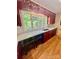Kitchen with red cabinets, white countertops, and wooden floor at 460 27Th Avenue Nw Cir, Hickory, NC 28601
