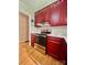 Kitchen featuring red cabinets, new oven, and view to a doorway at 460 27Th Avenue Nw Cir, Hickory, NC 28601