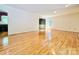 Open-concept living room with gleaming hardwood floors and neutral wall color at 460 27Th Avenue Nw Cir, Hickory, NC 28601