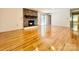 Living room with stone fireplace, hardwood floors, and sliding glass doors at 460 27Th Avenue Nw Cir, Hickory, NC 28601