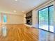 Spacious living room featuring stone fireplace and sliding doors to the exterior at 460 27Th Avenue Nw Cir, Hickory, NC 28601