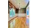 Living room with light hardwood floors and nature view through the window at 460 27Th Avenue Nw Cir, Hickory, NC 28601
