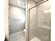 Modern bathroom features a glass shower with marble tile and sleek fixtures at 9653 Liberty Hill Dr, Mint Hill, NC 28227