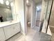 Modern bathroom with dual sinks, stylish vanity, and tiled shower at 9653 Liberty Hill Dr, Mint Hill, NC 28227