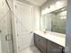 An elegant bathroom with modern vanity, marble accents and glass-enclosed shower at 9653 Liberty Hill Dr, Mint Hill, NC 28227