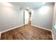 Bedroom with wood floors, neutral paint, walk-in closet and a modern design at 9653 Liberty Hill Dr, Mint Hill, NC 28227