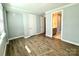 Comfortable bedroom features neutral walls and doorway to attached bathroom at 9653 Liberty Hill Dr, Mint Hill, NC 28227