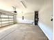 An expansive garage with a sink, concrete floor and automatic door at 9653 Liberty Hill Dr, Mint Hill, NC 28227