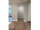 View of hallway with wood-look floors leading to the living area at 9653 Liberty Hill Dr, Mint Hill, NC 28227