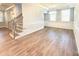 Spacious living room with hardwood floors and wainscoting at 9653 Liberty Hill Dr, Mint Hill, NC 28227