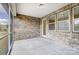 Covered patio with brick siding and view of the outdoors at 9653 Liberty Hill Dr, Mint Hill, NC 28227