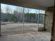 View of the screened patio showing brick siding and an outdoor view at 9653 Liberty Hill Dr, Mint Hill, NC 28227