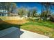 Expansive backyard featuring a well-maintained lawn, wooden privacy fence, and space for outdoor enjoyment at 2630 Rose St, Charlotte, NC 28208
