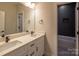 Modern bathroom featuring double sinks, quartz countertop, and a separate shower and tub at 2630 Rose St, Charlotte, NC 28208