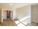 Spacious, light-filled bedroom featuring wood-look floors and bright neutral paint at 2630 Rose St, Charlotte, NC 28208