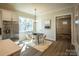 Cozy dining area with a modern table, stylish chairs, and a view of the kitchen at 2630 Rose St, Charlotte, NC 28208