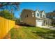 Charming home featuring a two-car garage, a fenced yard, and a well-manicured lawn at 2630 Rose St, Charlotte, NC 28208