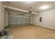 Spacious garage with a large door and ample space for storage and parking at 2630 Rose St, Charlotte, NC 28208