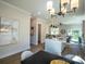 Bright kitchen featuring modern lighting, an island, and an open view to the living area at 2630 Rose St, Charlotte, NC 28208