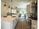 Stylish kitchen flowing into the living room with modern appliances and a large center island at 2630 Rose St, Charlotte, NC 28208