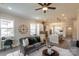 Living room features a gray sofa, decorative pillows, and a large clock at 2630 Rose St, Charlotte, NC 28208