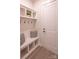 Mudroom with built-in bench, hooks, shelving and white cabinets at 2630 Rose St, Charlotte, NC 28208