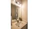 Modern powder room featuring a stylish mirror, vanity, and elegant fixtures at 2630 Rose St, Charlotte, NC 28208