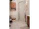 A bathroom with a shower, toilet and cabinet storage at 3021 Davis Park Rd, Gastonia, NC 28052