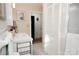 Bright bathroom featuring a large vanity, framed artwork, and functional closet with nearby storage at 3021 Davis Park Rd, Gastonia, NC 28052