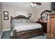 Bedroom featuring a large decorative wooden bed frame and matching dresser at 3021 Davis Park Rd, Gastonia, NC 28052
