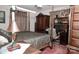 Warm bedroom design featuring a four poster bed, wardrobe and dedicated desk area at 3021 Davis Park Rd, Gastonia, NC 28052