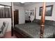Comfortable bedroom with four poster bed, stylish bedding, and neutral colored walls, perfect for relaxation at 3021 Davis Park Rd, Gastonia, NC 28052