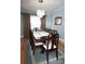 Elegant dining room features a large table, chandelier, and picture window at 3021 Davis Park Rd, Gastonia, NC 28052