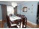 Elegant dining room features a large table, chandelier, and picture window at 3021 Davis Park Rd, Gastonia, NC 28052