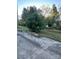 Front yard with green grass and large flowering bushes at 3021 Davis Park Rd, Gastonia, NC 28052