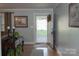 Inviting hallway with hardwood floors and view of the front yard at 3021 Davis Park Rd, Gastonia, NC 28052