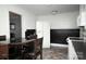 Open concept kitchen with stainless steel appliances, dark countertops, and cozy dining area with chairs at 3021 Davis Park Rd, Gastonia, NC 28052