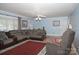 Spacious living room with hardwood floors and a cozy sectional sofa at 3021 Davis Park Rd, Gastonia, NC 28052