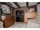 Cozy living room with a brick accent wall and decorative furnishings at 3021 Davis Park Rd, Gastonia, NC 28052