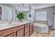 Bathroom with double vanity, soaking tub and separate shower at 12528 Generations St, Charlotte, NC 28278