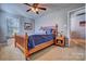 Charming bedroom with a wooden bed frame and neutral decor at 12528 Generations St, Charlotte, NC 28278