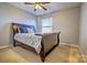 Serene bedroom featuring a sleigh bed and neutral color scheme at 12528 Generations St, Charlotte, NC 28278