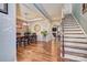 Bright dining room with hardwood floors and a view of the staircase at 12528 Generations St, Charlotte, NC 28278