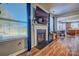 Living room with fireplace, hardwood floors and view of kitchen at 12528 Generations St, Charlotte, NC 28278