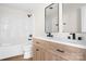 Modern bathroom with double vanity, light wood cabinets, and black matte fixtures at 16 Hill St, York, SC 29745