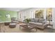 Spacious living room with light beige sofa and green geometric accent wall at 16 Hill St, York, SC 29745