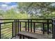 Private balcony with a bench and tree views at 2423 Vail Ave # A12, Charlotte, NC 28207