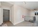 Hallway with a door, fire extinguisher, and carpeted stairs at 2423 Vail Ave # A12, Charlotte, NC 28207