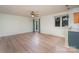 Light hardwood floors in living room with access to patio at 2423 Vail Ave # A12, Charlotte, NC 28207